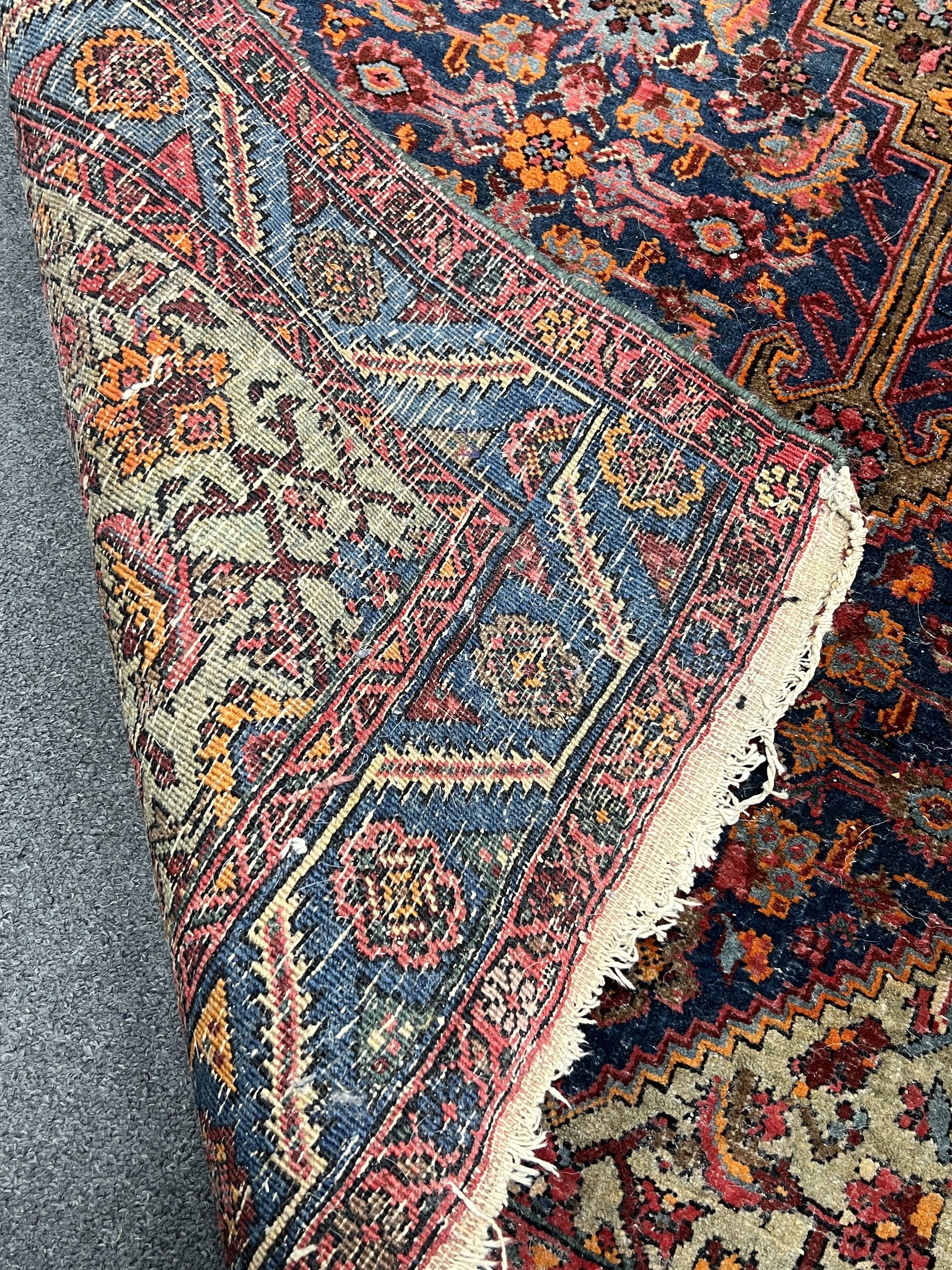 A North West Persian blue ground rug, 210 x 125cm